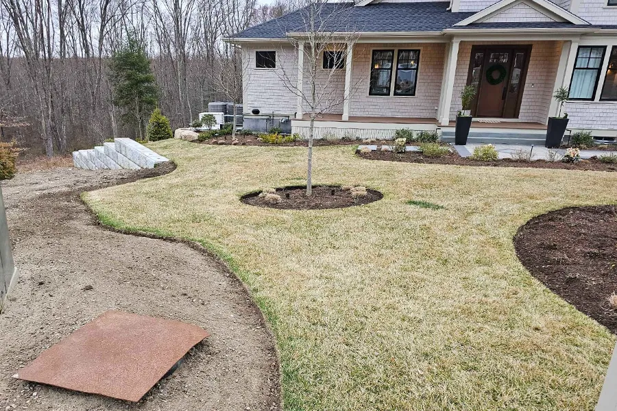 The lawn consists of pale, dormant grass