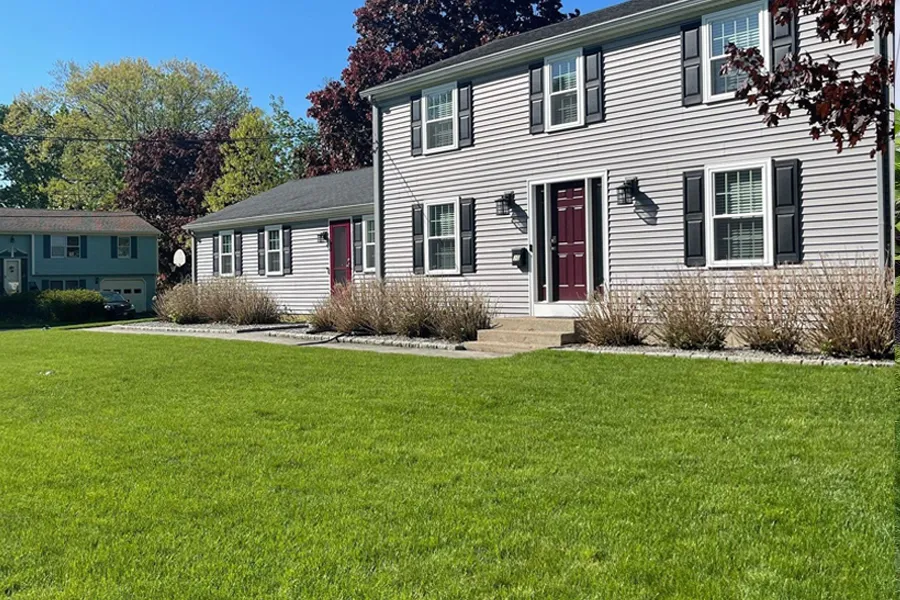 two story house with lawn-fertilization